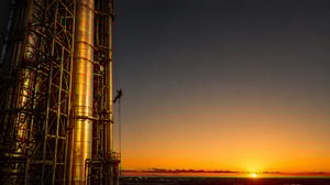 Rope access technician inspecting industrial structure illustrating challenges in asset integrity and inspection